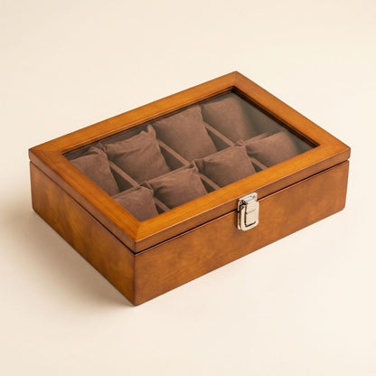 Boîte à montre Le Comptoir VIII en bois ambre, couvercle vitré et huit coussins de suédine brune