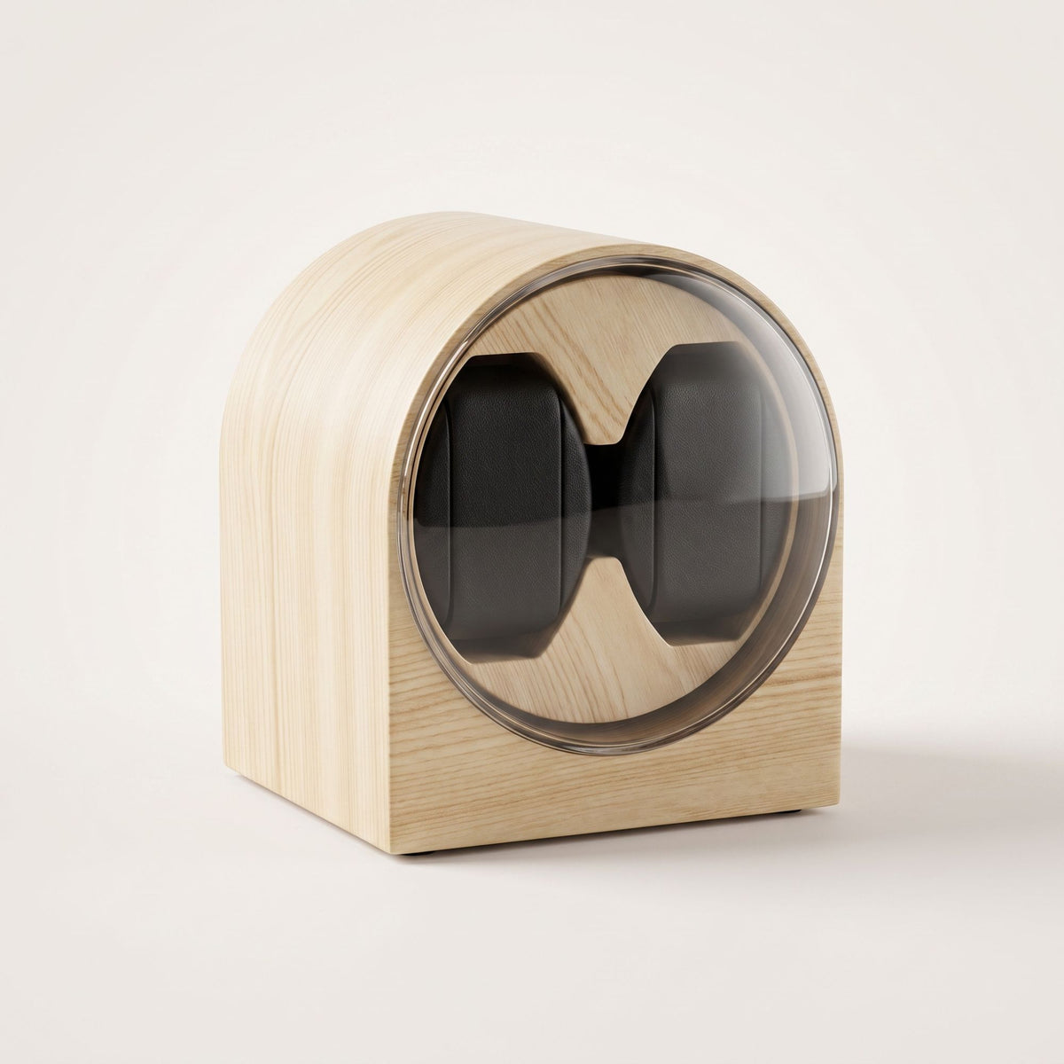 Remontoir deux montres L'Arche Duo en finition bois clair, deux coussins noirs visibles derrière le hublot