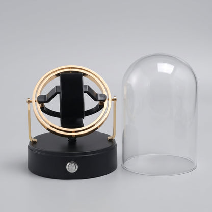 Remontoir Le Dôme avec le globe de verre retiré, berceau et coussin visibles